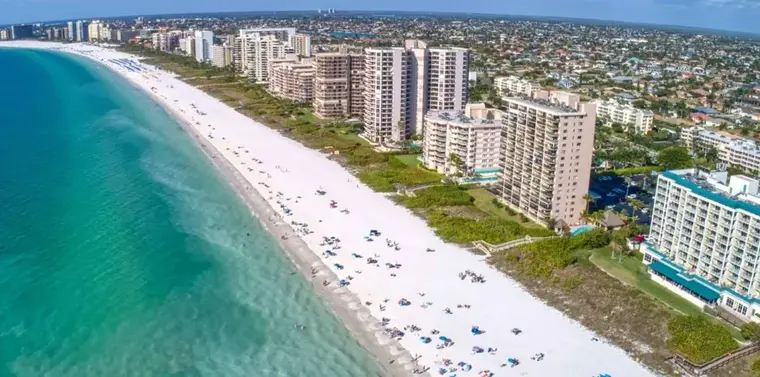 Gulf beachfront high-rise condos along the Naples coast in Collier County